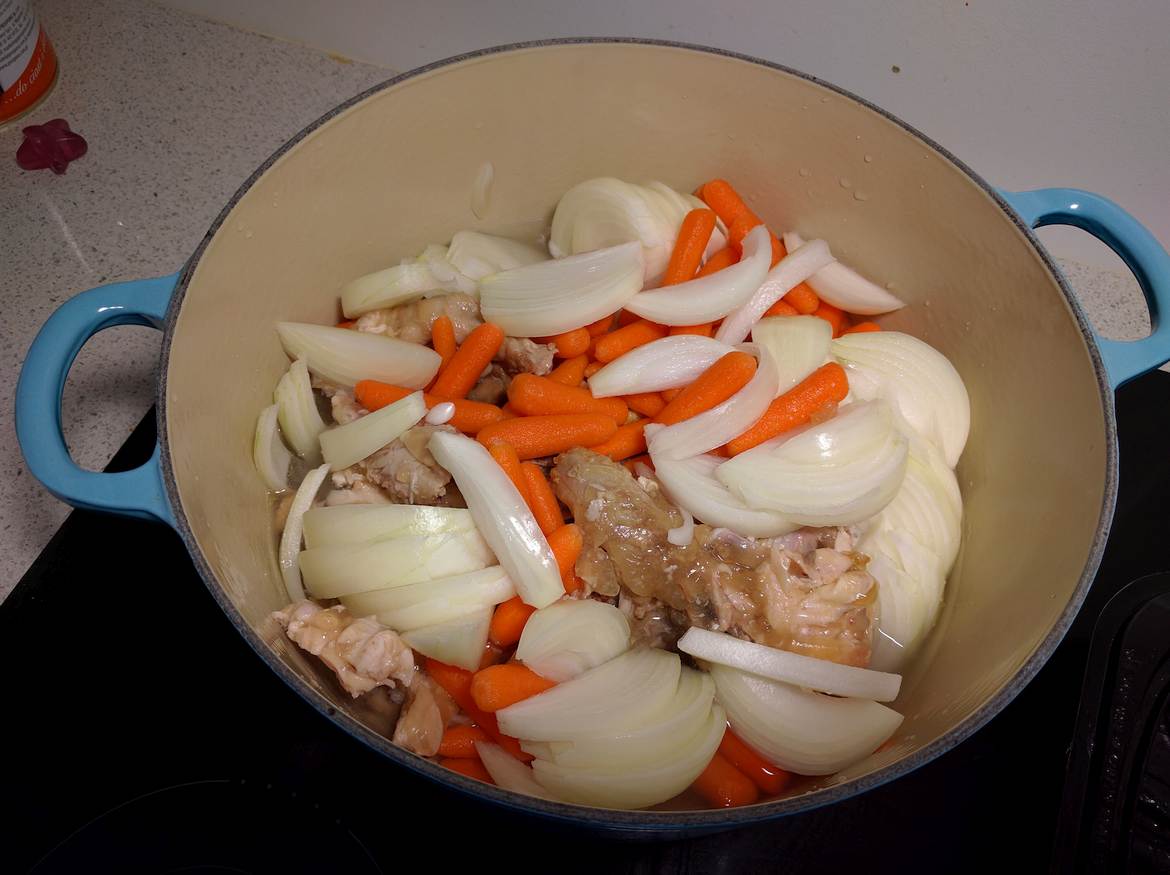 Chop the onions, combine with bones and carrots in a large pot.